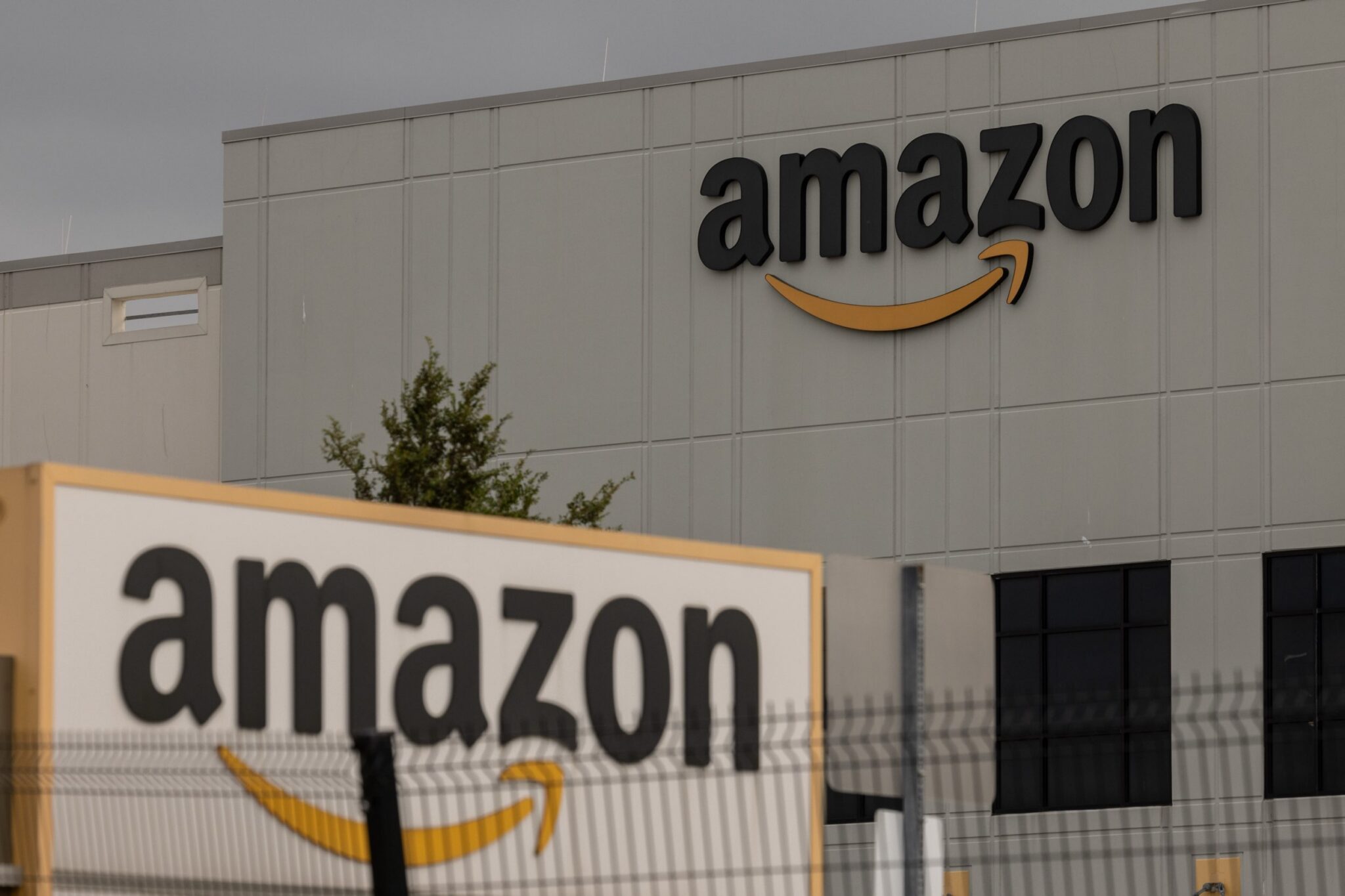 Amazon logos on the outside of one of the company's warehouses.