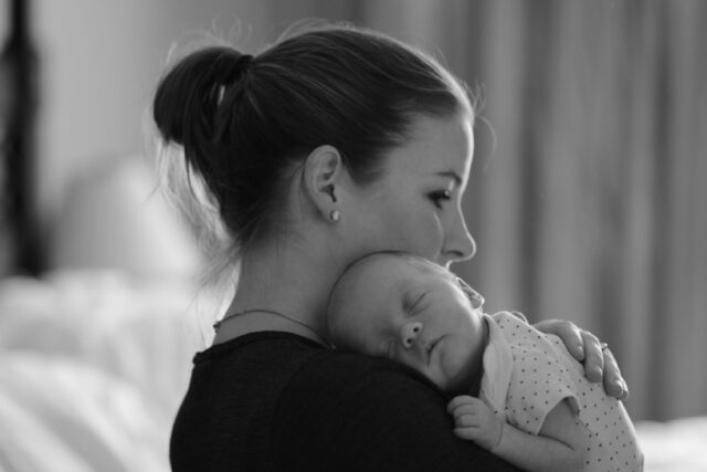 Mother holding an infant child