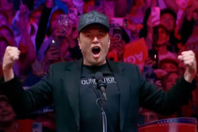 screenshot of Elon Musk at a 2024 Trump campaign rally, with arms raised up as he shouts into a microphone