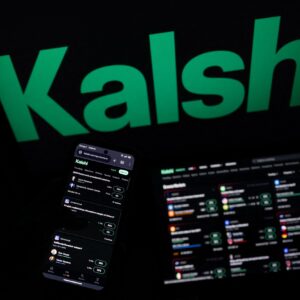 A smartphone and laptop screen display offers of wagers on the Kalshi prediction market