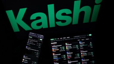 A smartphone and laptop screen display offers of wagers on the Kalshi prediction market
