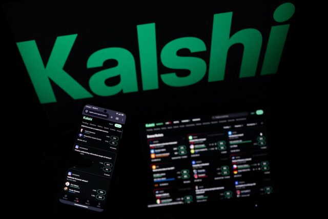 A smartphone and laptop screen display offers of wagers on the Kalshi prediction market