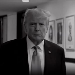 Trump walking down a hallway in a screenshot from a TV commercial.