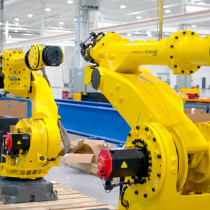 Heavy industrial robotic arms made by the Japan-based company FANUC stand ready for sale at the company's West Campus facility in Auburn Hills, Michigan.