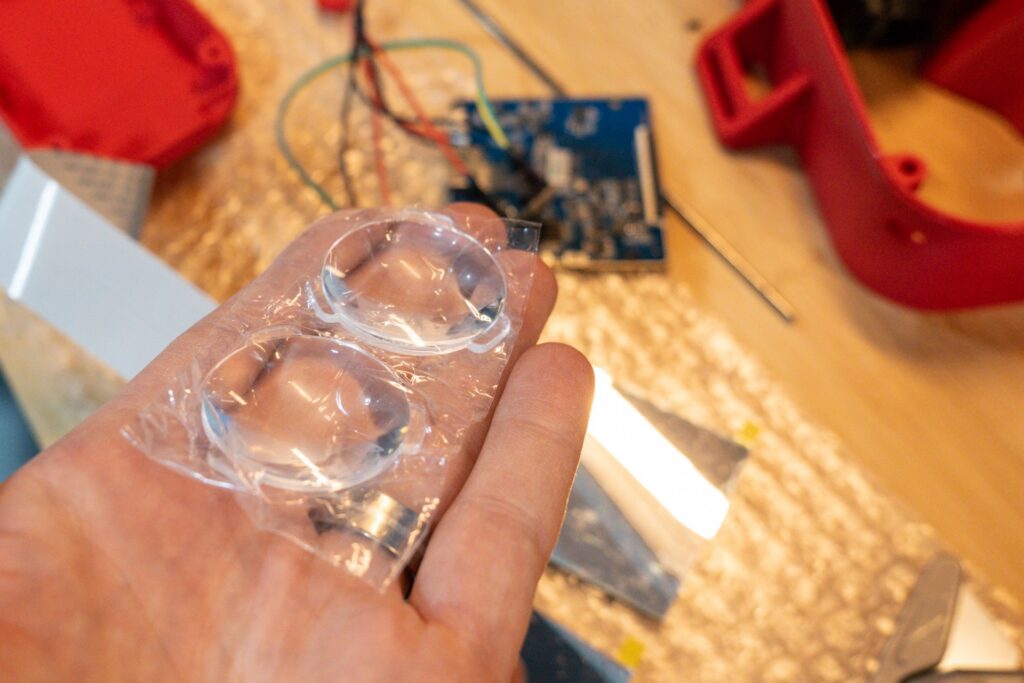 Two lenses in the palm of a hand