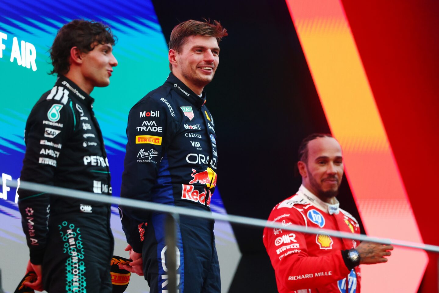 KUALA LUMPUR, MALAYSIA - OCTOBER 04: Race winner Max Verstappen of the Netherlands and Oracle Red Bull Racing Second placed Andrea Kimi Antonelli of Italy and Mercedes AMG Petronas F1 Team and Third placed Lewis Hamilton of Great Britain and Scuderia Ferrari on the podium during the F1 Grand Prix of Bahrain in Malaysia at Sepang Circuit on October 04, 2026 in Kuala Lumpur, Malaysia. (Photo by)
