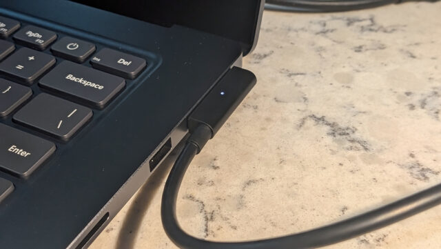 Image shows the magnetic charger plugged into the port
