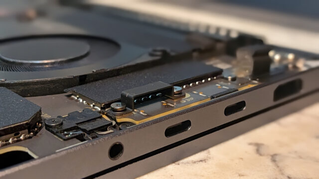 A view of the magnetic USB-C port with the laptop internals exposed. You can see the magnet housing.