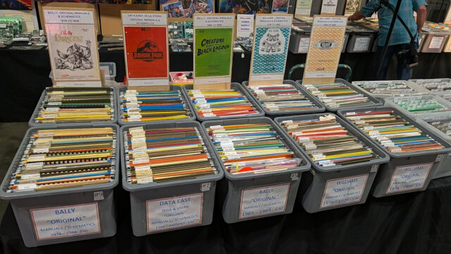 A booth selling original pinball machine manuals and schematics.