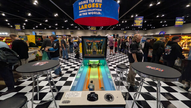 An original "Pro-Bowler" vintage machine sits on a checkered floor.