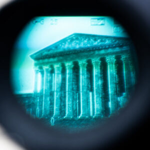 A court building seen through a camera viewfinder
