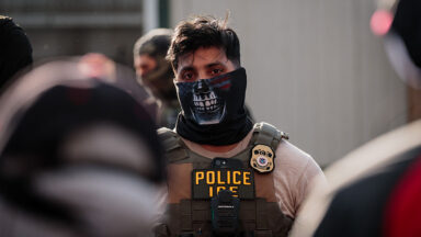 A masked ICE agent