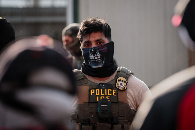 A masked ICE agent