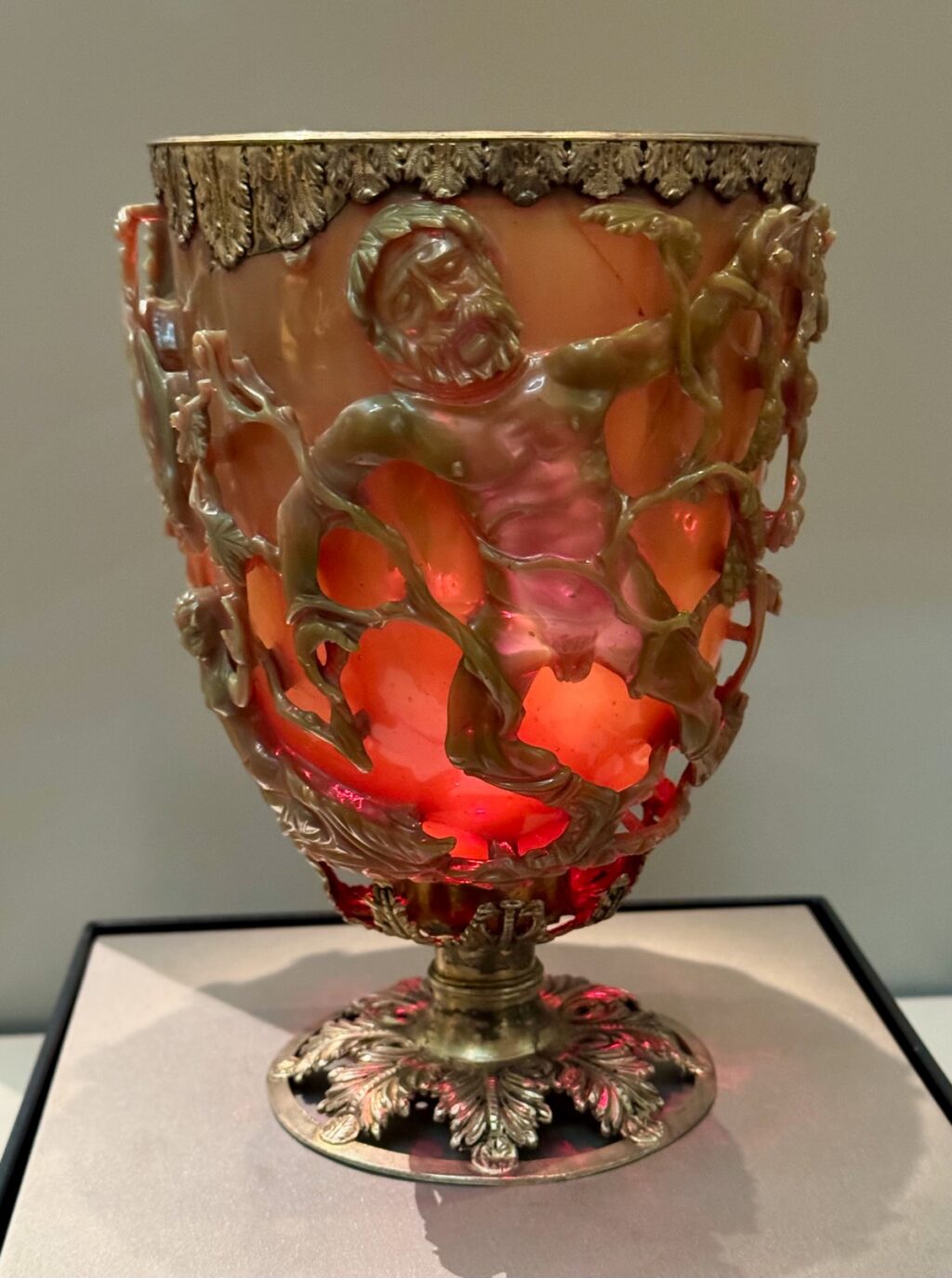 When viewed in transmitted light (backlit), the glass appears red.