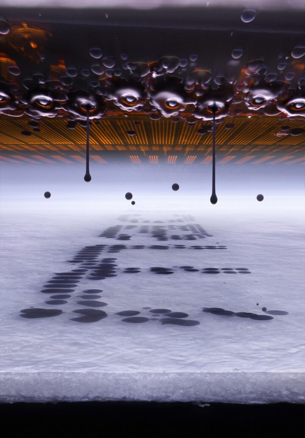 Microscopic view of an inkjet printer depositing ink on paper.