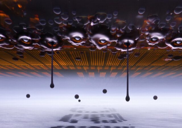 microscopic view of an inkjet printer depositing ink onto paper