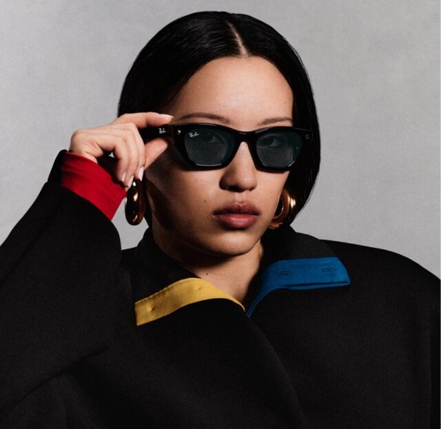 The LED light shines as a woman records with Ray-Ban Meta smart glasses.