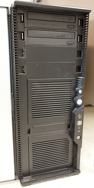 Note the drive bay rails (top), two somewhat restrictive 120mm fan intakes (middle and bottom), and extensive side vents on the front door. The vents are side-facing rather than front-facing to angle noise away from the user. (Antec P180)
