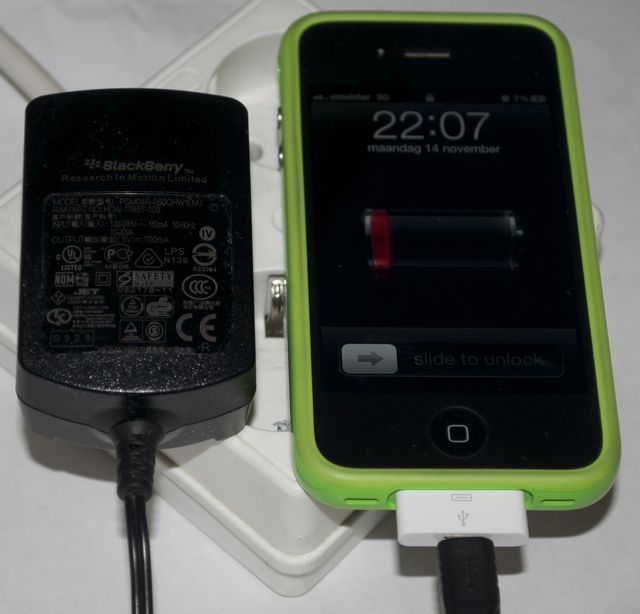 The iPhone 4 charging from a Blackberry charger