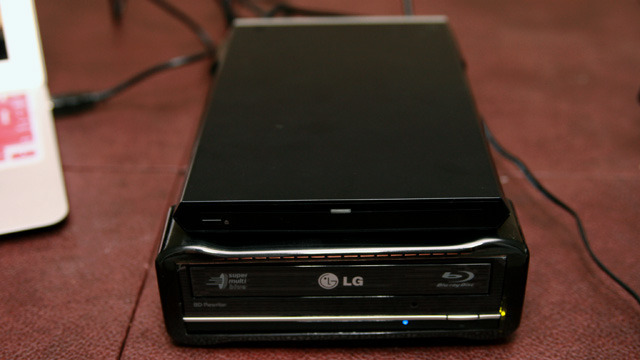 Compare to Sony's Blu-ray drive "dock" for its Vaio Z ultraportable. The Sony drive can't burn Blu-ray discs, but at least you can carry it with you.