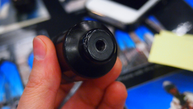 The lenses are stored in an aluminum tube that doubles as a handle and tripod mount.