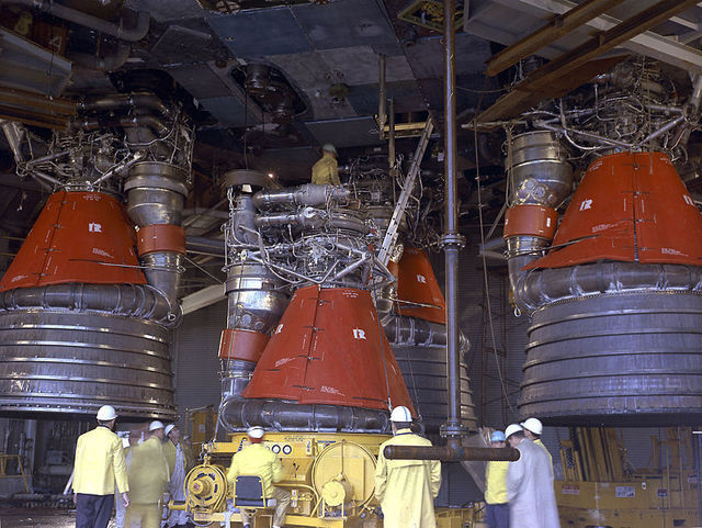 A close-up of the engines in question, with some NASA employees for scale.