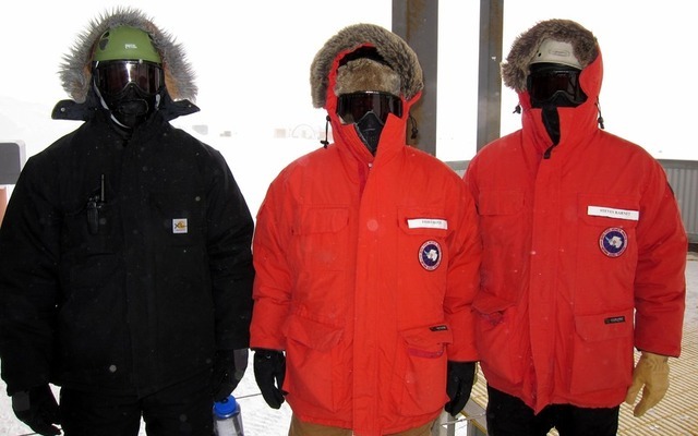 Ralf Auer, left, and Steve Barnet, right, with James Roth of the IceCube team, dressed for a walk to the IceCube data center.