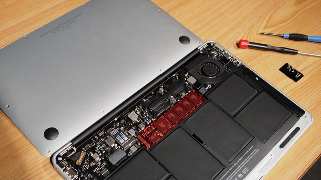 The guts of a MacBook Air. The stock SSD is highlighted in red.