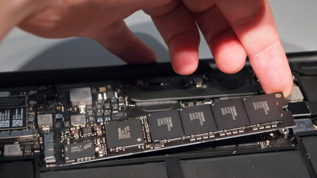 Lift the SSD module at a slight angle to pull it out of its slot.