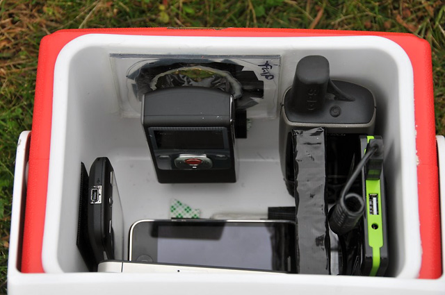Instead of hauling sixers for tailgating, this cooler is packed with an iPhone, a Droid Eris, a Garmin GPS unit, and a Flip video camera, along with hand warmers to keep everything from freezing in the upper atmosphere.