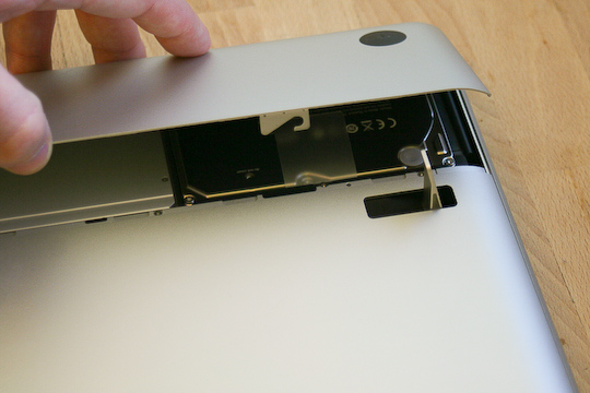 A small latch on the back of the MacBook Pro pops the compartment open
