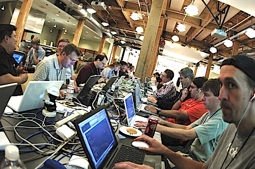 Developers hack away at iPhone apps at iPhoneDevCamp 1. Photo CC by Alexander Muse.