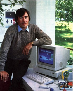 EA founder Trip Hawkins poses with an Amiga 1000