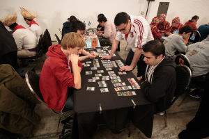 Team Sealed starts with each team opening a bunch of packs and then trying to turn the (random) cards into useful decks. England is pictured here; team captain Fabrizio Antaeri is the one standing up.