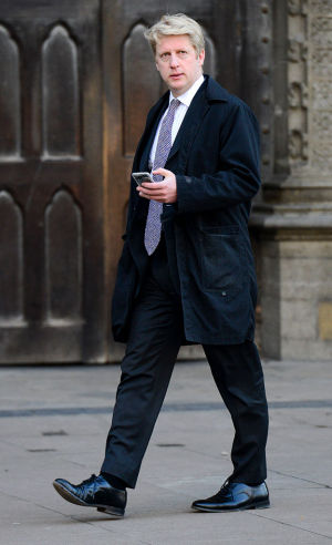 Jo Johnson MP, walking past Westminster Abbey