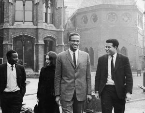 Malcolm X in Oxford with Eric Abrahams, the Student Union president, before addressing university students on the subject of extremism and liberty, December 3 1964.