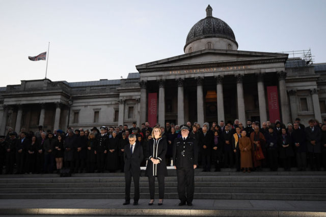 Mayor of London Sadiq Khan, home secretary Amber Rudd, and acting Scotland Yard chief Craig Mackey stand in silence during a candlelit vigil to remember the victims of the Westminster attack.